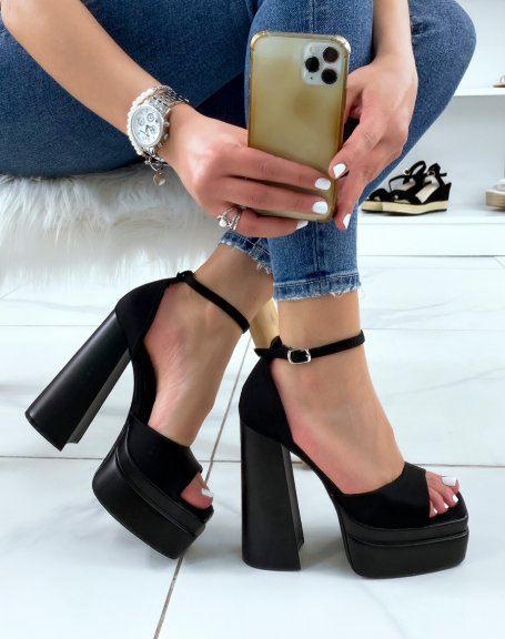 Black fabric sandals with thick front straps and imposing heel