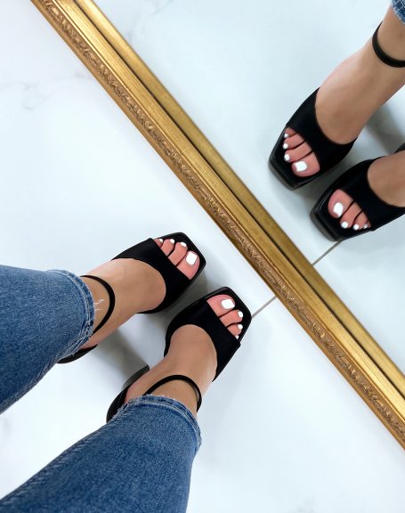 Black fabric sandals with thick front straps and imposing heel