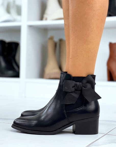 Black faux leather ankle boots with integrated bow