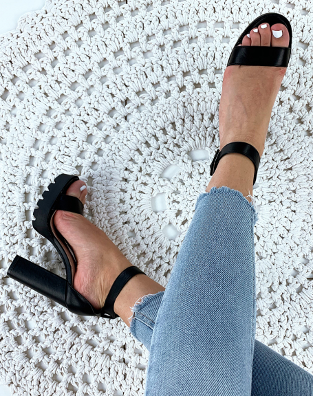 Black faux leather heeled sandals with lug soles