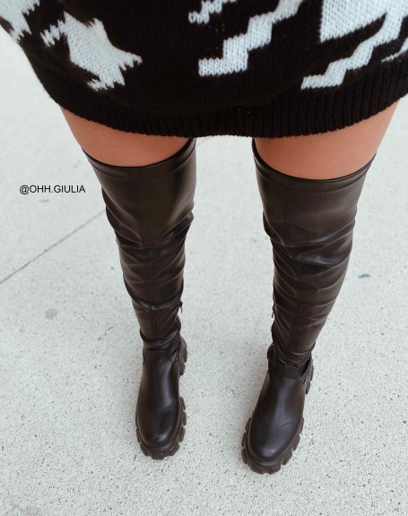 Black faux leather thigh-high boots with notched soles
