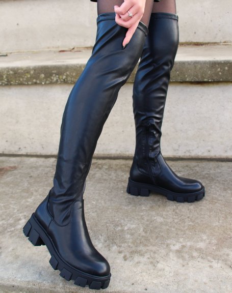 Black faux leather thigh-high boots with notched soles