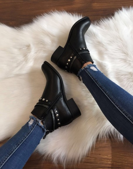 Black flat ankle boots with different straps