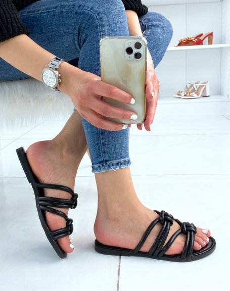 Black flat mules with crossed straps