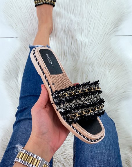 Black flat mules with multiple details and thin golden chain