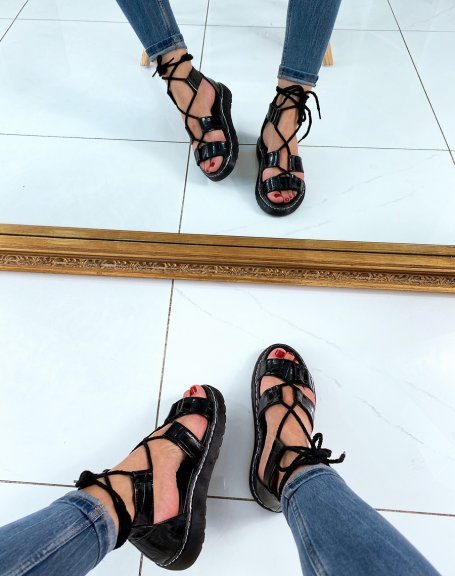 Black flat sandals with ankle laces