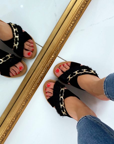 Black flat sandals with fringe and gold chain