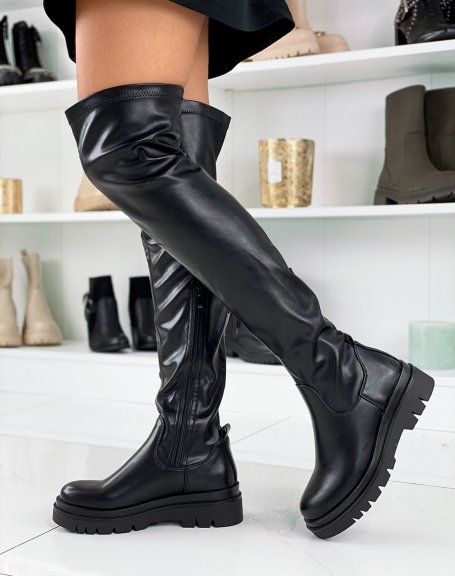 Black flat thigh-high boots with notched platform