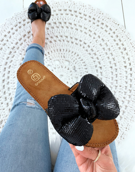 Black flip flops with big puffy knot