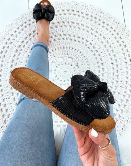 Black flip flops with big puffy knot