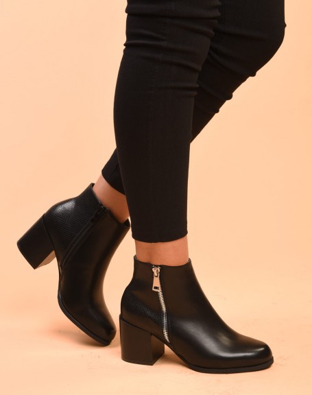 Black heeled ankle boots with closure & python patterns