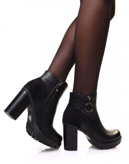 Black heeled ankle boots with decorative zipper