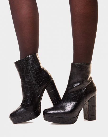 Black heeled ankle boots with large croc-effect platform