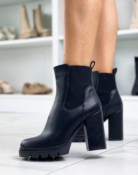 Black heeled ankle boots with notched platform