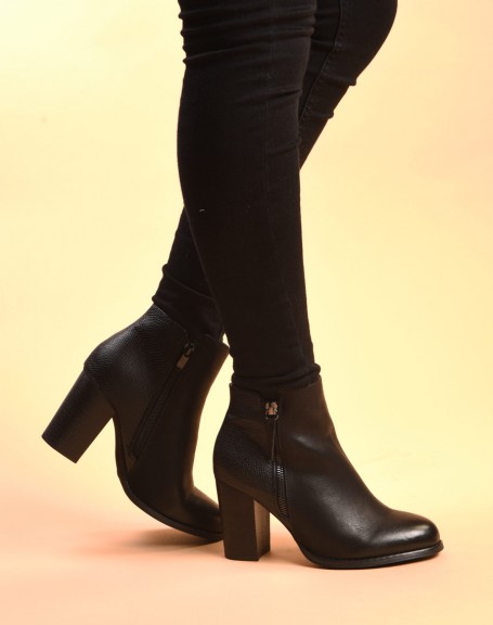 Black heeled ankle boots with python patterns