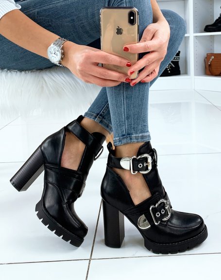 Black heeled ankle boots with straps