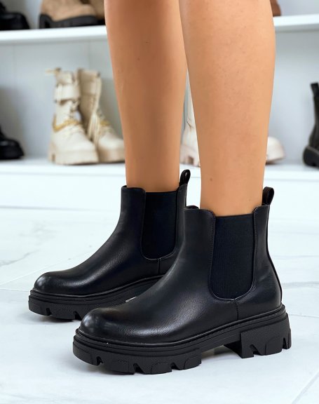 Black heeled chelsea boots with notched sole
