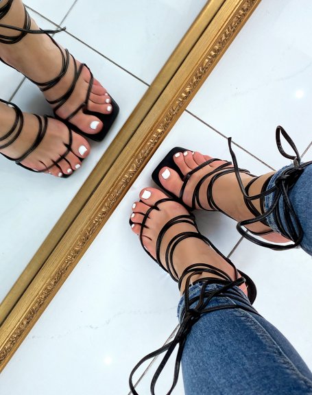 Black heeled sandals with between-fingers and multiple straps