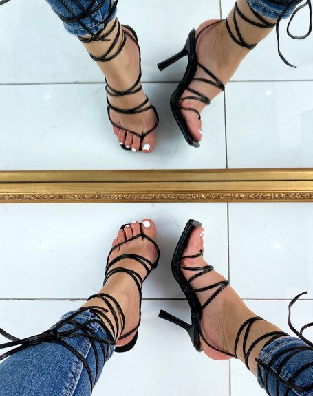 Black heeled sandals with between-fingers and multiple straps