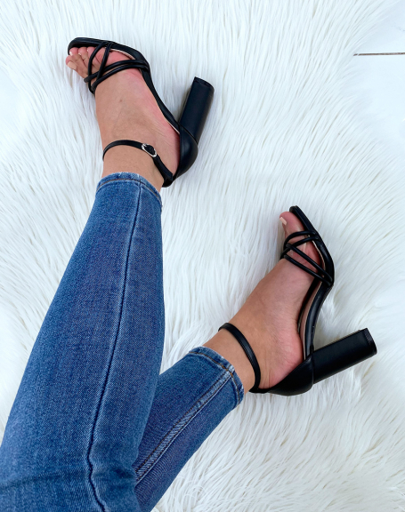 Black heeled sandals with criss-cross straps