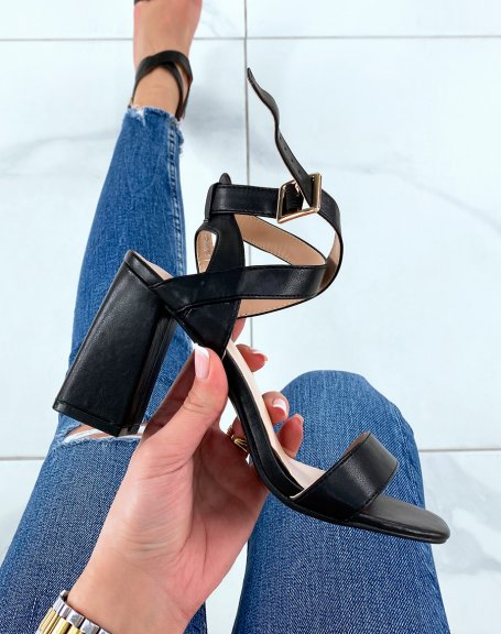 Black heeled sandals with criss-cross straps