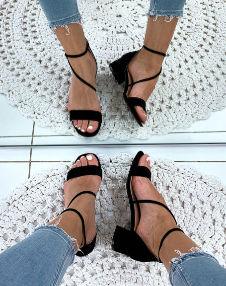 Black heeled sandals with crossed straps