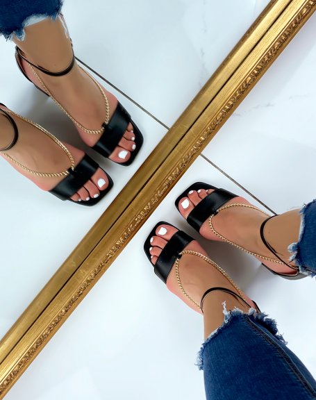 Black heeled sandals with dropped chains