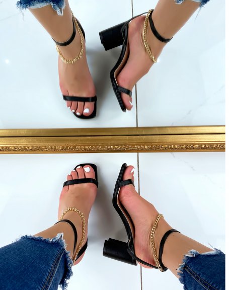 Black heeled sandals with gold chain