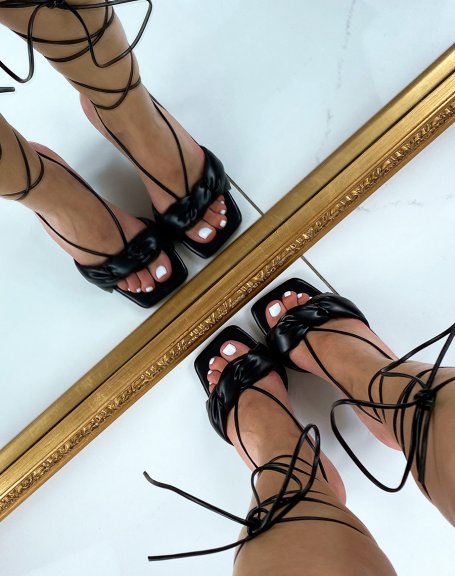 Black heeled sandals with high lace and twisted strap