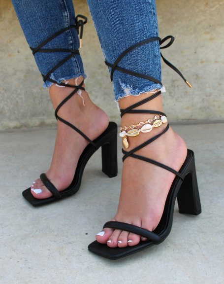 Black heeled sandals with long straps