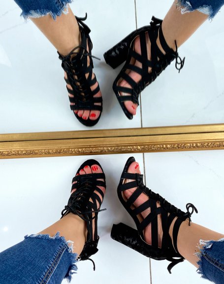 Black heeled sandals with multiple straps and laces