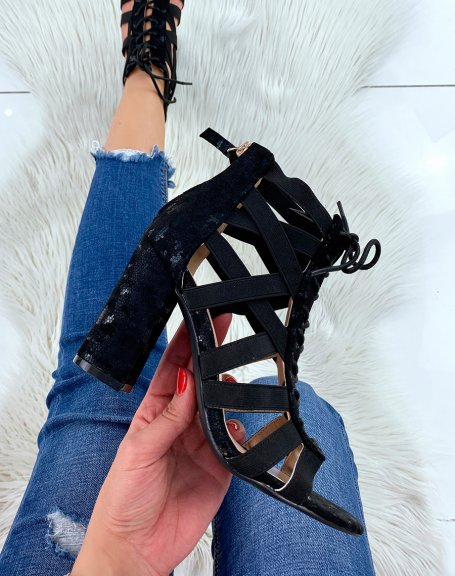 Black heeled sandals with multiple straps and laces