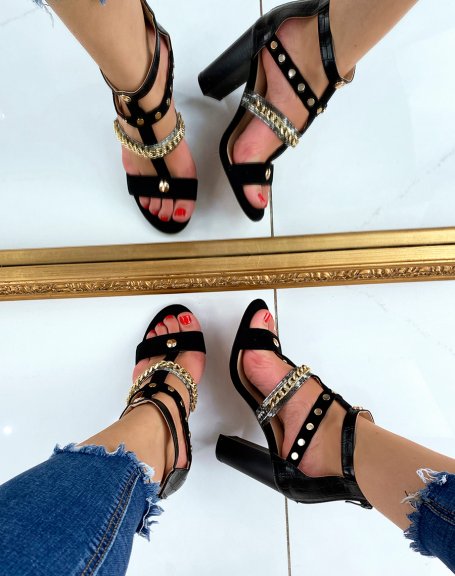 Black heeled sandals with multiple straps with gold and animal details
