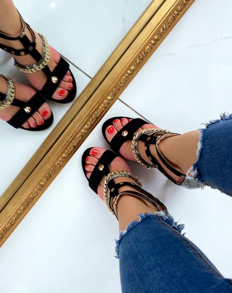 Black heeled sandals with multiple straps with gold and animal details