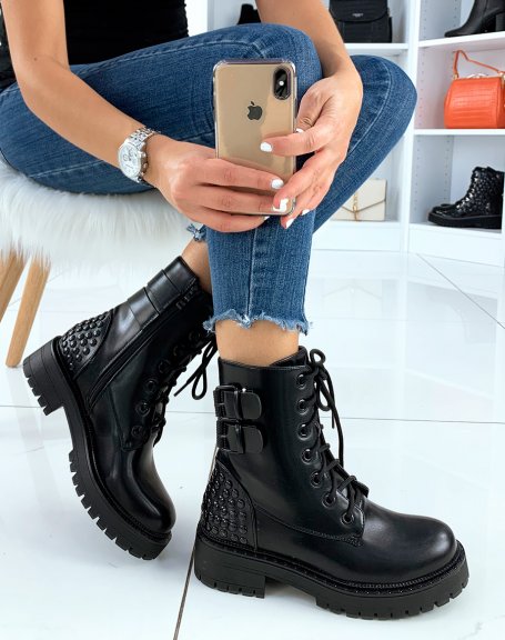 Black high ankle boots adorned with black studs