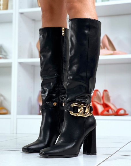 Black high heel boots with gold chain