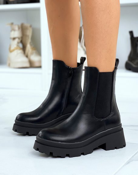 Black high heel Chelsea boots with notched sole