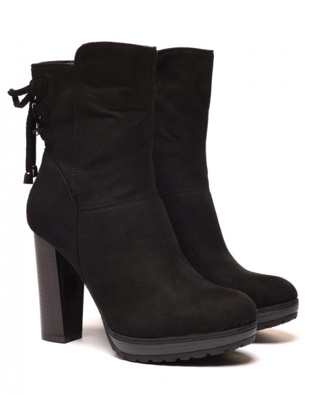 Black high heeled ankle boots with corset-style lace