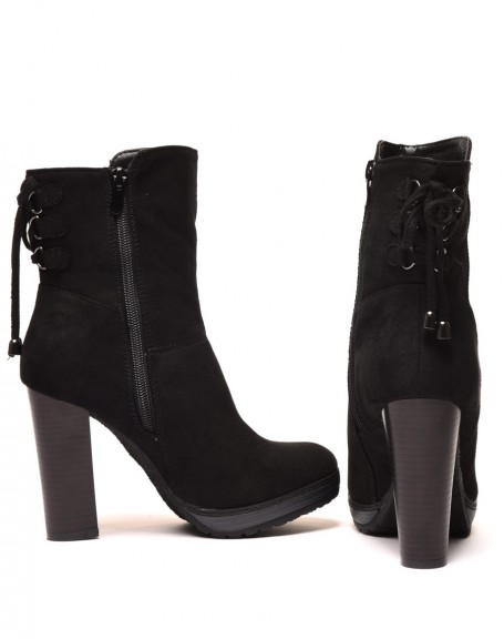 Black high heeled ankle boots with corset-style lace