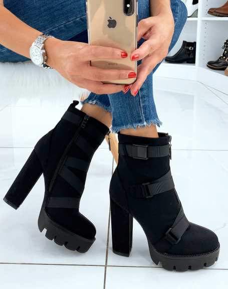 Black high heeled ankle boots with multiple straps