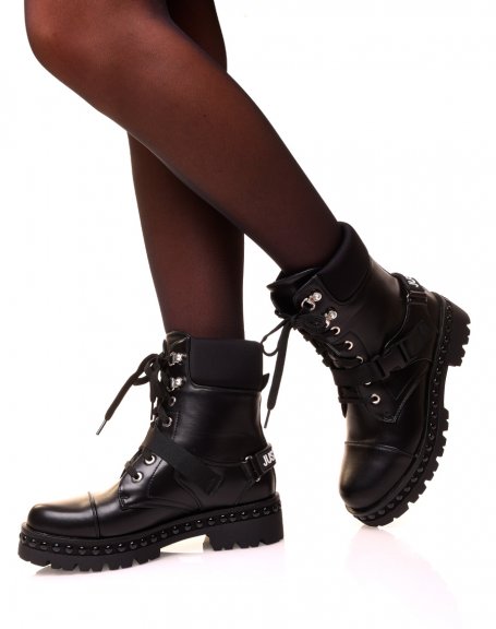 Black high-top ankle boots with laces and straps