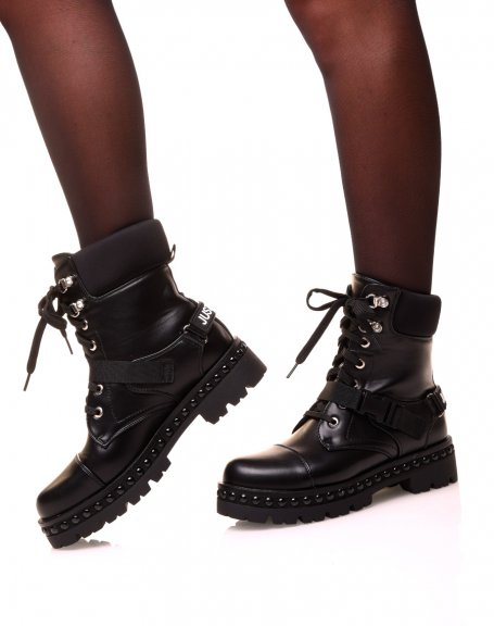 Black high-top ankle boots with laces and straps