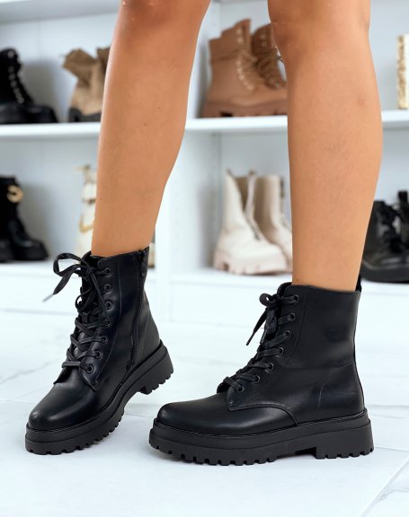 Black lace-up ankle boots with a notched flat sole