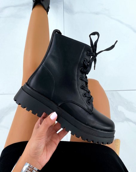 Black lace-up ankle boots with a notched flat sole