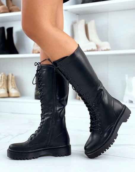 Black lace-up boots with flat lug sole