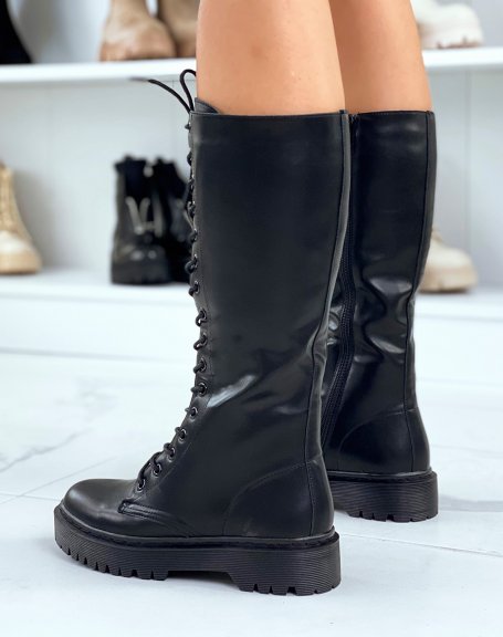 Black lace-up boots with flat lug sole