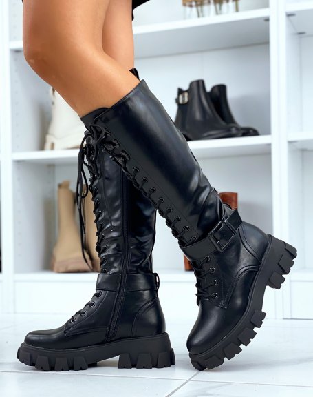 Black lace-up boots with lug soles and strap