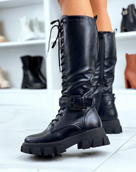 Black lace-up boots with lug soles and strap