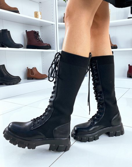 Black lace-up sock-style boots with lug soles