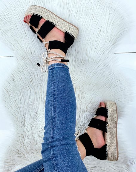 Black lace-up wedges and hessian sole